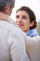 Image showing Couple, outdoor and smile with love at beach with kindness, support and care in marriage. Happy, woman and gratitude for partner on holiday, date or relax on vacation together in calm morning