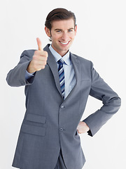 Image showing Portrait, businessman and happy thumbs up in studio with mockup for decision on white background. Corporate, male person and smile in excitement with gesture for encouragement, choice and support