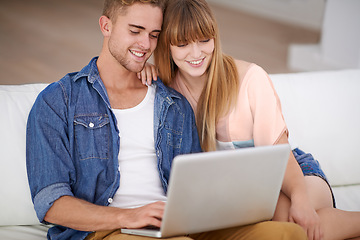 Image showing Happy, couple and relax with laptop on sofa to watch movies with subscription for streaming in home. Online, man and woman reading on couch and scroll the news on website, blog or social media