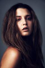 Image showing Hair, beauty and portrait of woman on gray background for wellness, healthy texture and growth. Confidence, serious and face of person with hairstyle for shampoo, haircare and cosmetics in studio