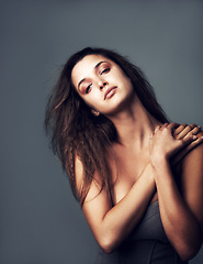 Image showing Hair, confident and portrait of woman on gray background for wellness, healthy texture and growth. Attitude, serious and face of person with hairstyle for beauty, haircare and cosmetics in studio