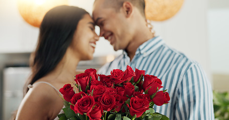 Image showing Couple, flowers and kiss for anniversary celebration, marriage and loyalty or commitment to love. People, happy and romance for relationship milestone, bonding and plant gift for support at home