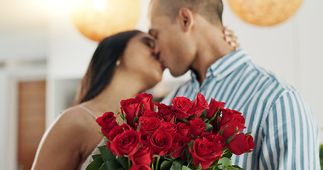 Image showing Couple, flowers and kiss for anniversary celebration, marriage and loyalty or commitment to love. People, happy and romance for relationship milestone, bonding and plant gift for support at home