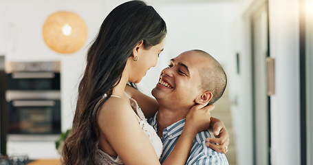 Image showing Couple, hug and kissing for love at home, happy and support in marriage and embrace for romance. People, spin and bonding together for relationship, lovers and commitment or loyalty in apartment