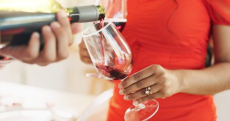 Image showing Couple, hands and bottle of red wine for celebration of love, romance and valentines day on their anniversary. People or lover on date with glasses, drinks and alcohol for toast, success and luxury