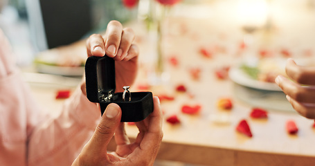 Image showing Couple, hands and proposal with ring for love, marriage and celebration on valentines day or anniversary dinner. Closeup of people with jewelry for engagement with finger for romance and commitment