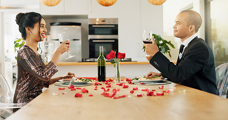 Image showing Couple, home and toast with red wine for celebration of love, romance and valentines day on their anniversary. Happy man and woman on date with glasses, drinks and red champagne for success or luxury