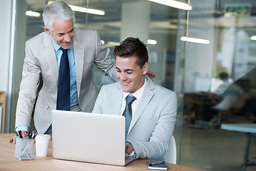 Image showing Senior businessman, employee and laptop for training, leadership and mentor on technology. Businesspeople, consulting and advice or feedback on report, proposal and discussion or teaching in office