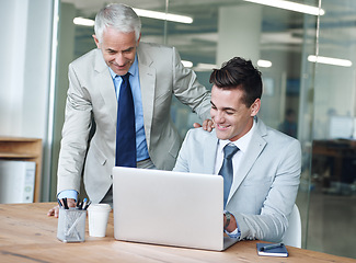 Image showing Senior businessman, employee and laptop for problem solving, leadership and mentor on tech. Businesspeople, consulting and advice or feedback on report, proposal and discussion or teaching in office