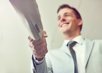 Image showing Handshake, business people and agreement in partnership, teamwork and thank you for recruitment. Male person, low angle and deal for merger in workplace, collaboration and support in cooperation