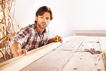 Image showing Man, carpenter and wood with craft, home and tools for work, building and maintenance. Handyman, workbench and diy or craftsmen, contractor and artisan with face, thinking or planning for improvement