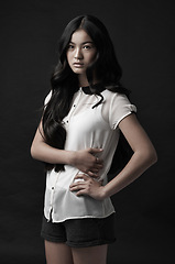 Image showing Woman, portrait and fashion with style in studio or dark aesthetic or clothing confidence, black background or mockup space. Asian person, model and face or serious or Japanese beauty, cool or outfit