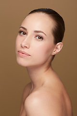 Image showing Skincare, glow or portrait of natural model in studio isolated on brown background for pride or wellness. Smooth face, body cosmetics or confident woman or healthy female person with shine or beauty