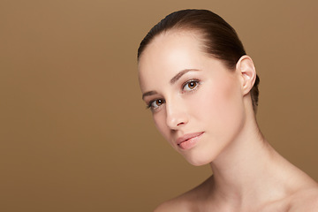 Image showing Skincare, space or portrait of natural model in studio isolated on brown background for pride or wellness. Smooth face, cosmetics or confident woman or healthy person with shine or beauty mockup