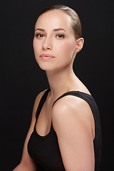 Image showing Studio, portrait and beauty of woman with confidence, cosmetic and facial treatment on black background. Model, pride or make up for spa cosmetology for glow face, bodycare or collagen for soft skin