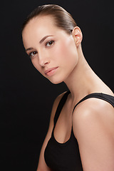 Image showing Woman, positive and portrait in studio with cosmetics, closeup and beauty results of cosmetology in mockup. Model, face and skincare with retinol for glow, collagen and make up on black background