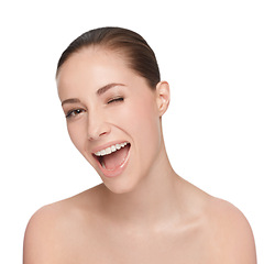 Image showing Portrait, happy and woman wink for skincare, flirt or natural beauty isolated on white studio background. Face, blink and smile of model in cosmetics excited for spa facial treatment for healthy skin