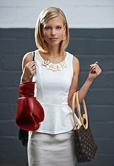 Image showing Woman, portrait and fashion with bags or boxing gloves or designer style with exercise equipment, confidence or beauty. Female person, face and workout gear for fighter cardio shopping or challenge