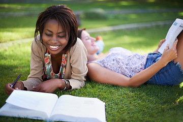 Image showing Studying, university and students on grass with books for learning, knowledge and reading in park. Education, friends and women with textbook for information, exam preparation and college outdoors