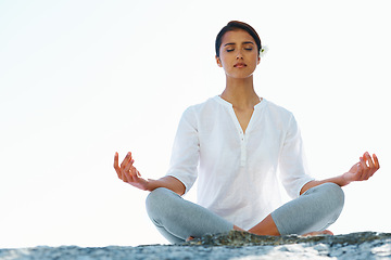 Image showing Woman, meditation and yoga in zen for spiritual wellness, awareness or outdoor beach with sky background. Calm female person or yogi meditating for inner peace, breathing or health on mockup space