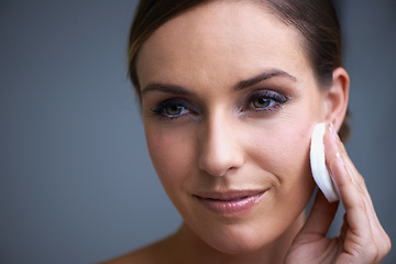 Image showing Skincare, smile and woman in studio with natural, beauty and cosmetic facial routine for wellness. Health, happy and female person with face dermatology treatment by gray background with mockup.