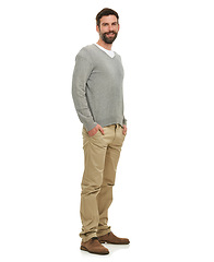 Image showing Happy, portrait and cool man in studio with casual clothes for fashion in V neck pullover top, pants and confidence. Young model or person from the USA with relaxed style and on a white background