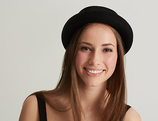 Image showing Woman, fedora and fashion with portrait in studio with confidence, pride and retro style by white background. Hipster girl, model or person with trendy hat, clothes and happy with face in Argentina