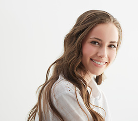 Image showing Woman, smile and fashion in studio portrait with confidence, trendy style and pride by white background. Isolated girl, person or model with clothes, face and happy with shirt in Argentina