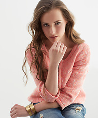 Image showing Woman, fashion and portrait in studio with confidence, style and pride in trendy jeans by white background. Isolated girl, person or model with edgy clothes, face or jewelry with sweater in Argentina