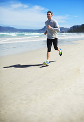 Image showing Fitness, mature or man on beach running for exercise, training or outdoor workout at sea. Sports person, fast runner or healthy athlete in nature for cardio endurance, wellness or challenge on sand