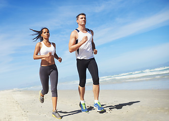 Image showing Fitness, teamwork or couple on beach running for exercise, training or outdoor workout at sea. Sports people, runners or healthy athletes in nature for cardio endurance, wellness or challenge on sand