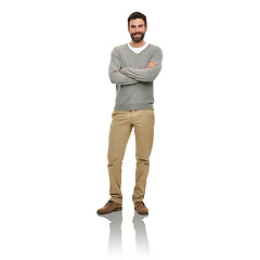 Image showing Happy, portrait and man in studio with casual clothes for fashion in V neck pullover, pants and confidence or arms crossed. Young model or person from USA with relaxed style and on a white background