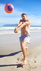 Image showing Beach, volleyball and man with wellness, vacation and sunshine with player and workout for training. Person, athlete and guy with fun, sand or seaside with cardio and practice for health or adventure