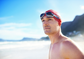 Image showing Beach, goggles and man with cap, travel and swimmer with vacation and summer break with getaway trip. Person, athlete and guy with holiday or seaside with sunshine and fitness with wellness or energy