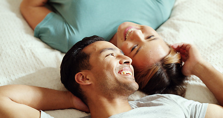 Image showing Happy couple, bedroom and talking while lying on bed for love and marriage bonding happiness in comfy home. Asian man and woman joke and relax in romantic hotel together in morning from above