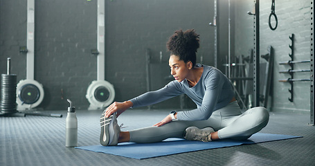 Image showing Black woman, gym and stretching, fitness and exercise motivation and body training for sport and health. Healthy, wellness and preparing for workout, warm up and stretch for active lifestyle.