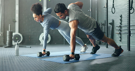 Image showing Fitness, gym and couple plank with weight dumbbell for workout, strength and training lifestyle. Exercise, wellness and health of interracial people weightlifting for strong abdomen muscles.