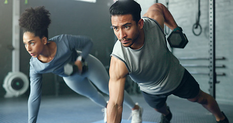 Image showing Fitness, gym and dumbbell, people doing weightlifting and exercise for body training with focus and strong muscle. Man, woman and workout on mat, endurance and serious athlete for active lifestyle.