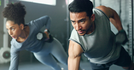 Image showing Fitness, gym and dumbbell, people doing weightlifting and exercise for body training with focus and strong muscle. Man, woman and workout on mat, endurance and serious athlete for active lifestyle.