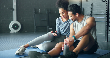Image showing Smartphone, fitness and personal trainer talking to client for exercise goal planning on mobile app, internet search or health software. Young sports people on floor in conversation and using phone