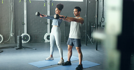 Image showing Exercise, black woman and man with kettlebell, fitness and workout for health, wellness and in gym. Healthy couple, gym equipment and doing training with stretching, routine and focus in sportswear.