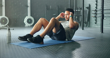 Image showing Exercise abdomen training, man and fitness body workout in gym. Young Asian person athlete, healthy sports wellness goal and core muscle power crossfit motivation on yoga mat in health studio