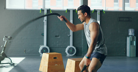 Image showing Fitness, man and rope exercise in gym, sports club and training workout for muscle, energy and wellness. Fast, action and speed bodybuilder with battle ropes, motivation and focus for building power