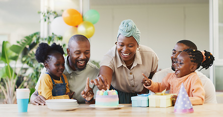 Image showing Black family, birthday cake and candles for children to celebrate with parents at a table. African woman, men and happy kids at home for a party, quality time and bonding or fun with love and care