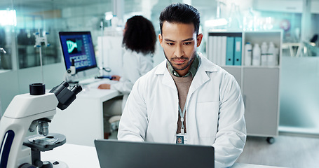 Image showing Scientist, man and reading computer for laboratory test, typing report or medical results of DNA at night. Asian expert thinking on computer for science research, biotechnology and molecule analysis