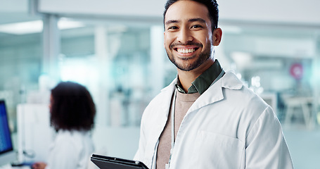 Image showing Man, face and scientist with tablet in laboratory and online research of genetics specialist in healthcare. Asian doctor, portrait and happy at work in pharmaceutical career and working on innovation