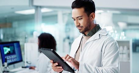 Image showing Scientist, man and tablet for laboratory research, DNA analysis and results in medical study at night. Young science expert or people in biotechnology, digital software or computer for test checklist