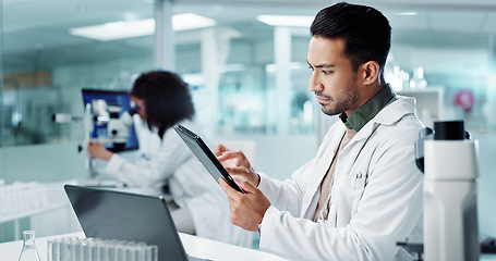 Image showing Scientist, man and tablet for laboratory research, DNA analysis and results in medical study at night. Young science expert or people in biotechnology, digital software or computer for test checklist