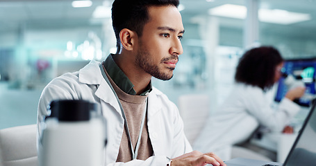 Image showing Laptop, man or scientist typing to research in laboratory for a chemistry report or medical test feedback. Internet, person reading or science update for online medicine development news on website