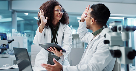 Image showing Science, teamwork and high five with laptop in laboratory for test breakthrough, pharmaceutical review or excited. Scientist, collaboration or mentor for research success, talking or digital analysis